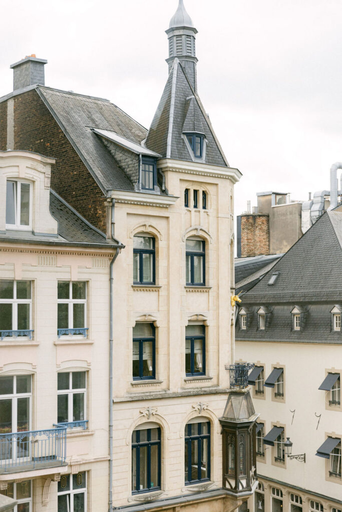 Elegant cream-colored historic building facade in Luxembourg City, a short walk from Cercle Cité