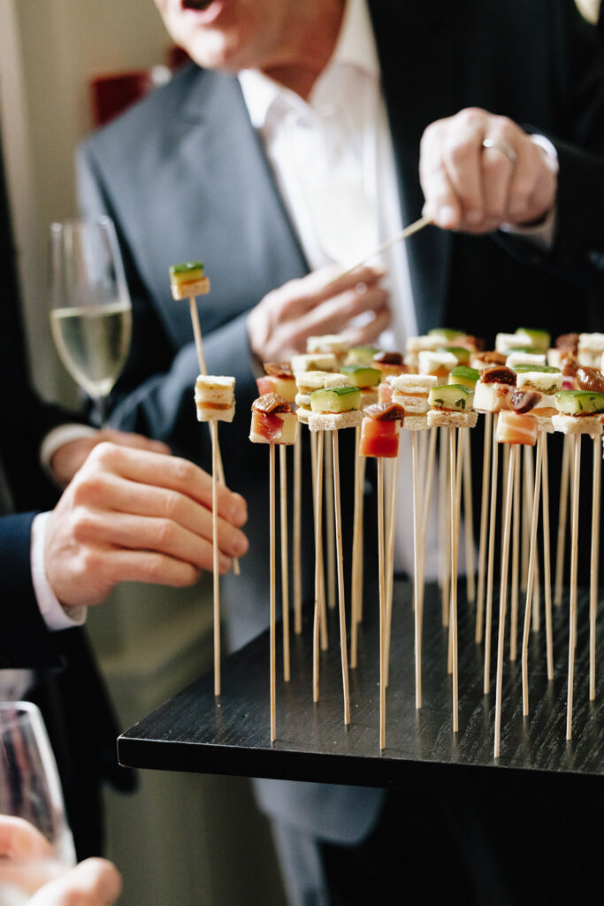 Steffen Traiteur canapés being served on skewers during wedding cocktail hour at Château de Mirwart Belgium