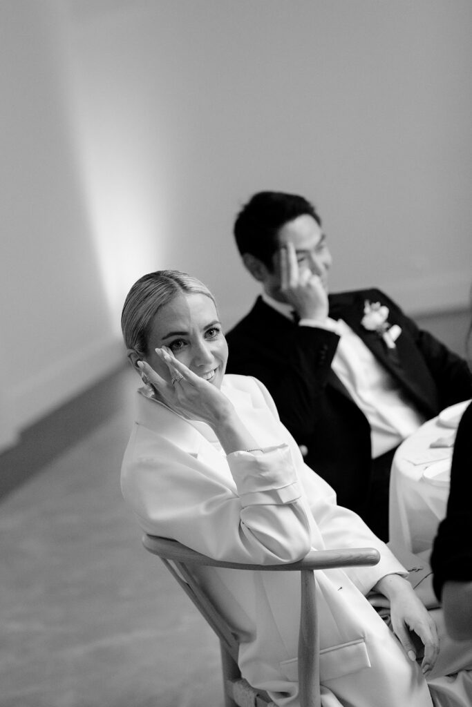 Black and white photo of Carla and Robin sharing a quiet moment together during their wedding reception at Château de Mirwart Belgium