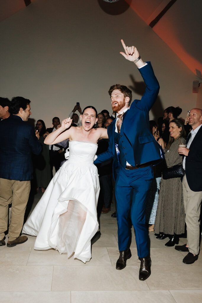 Hazelnut House 1851 Luxembourg wedding reception, the bride and groom making a joyful entrance to the dance floor as guests celebrate around them